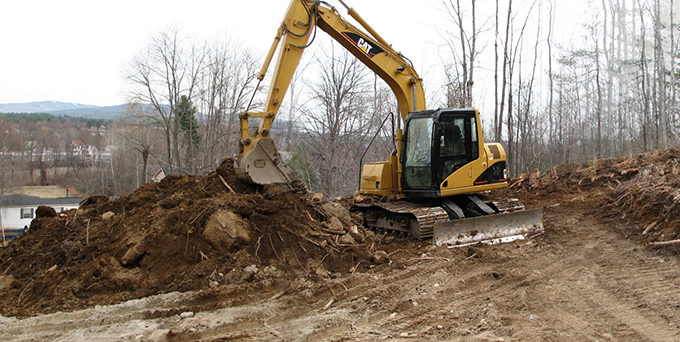 CAT Excavator relocating ground for construction